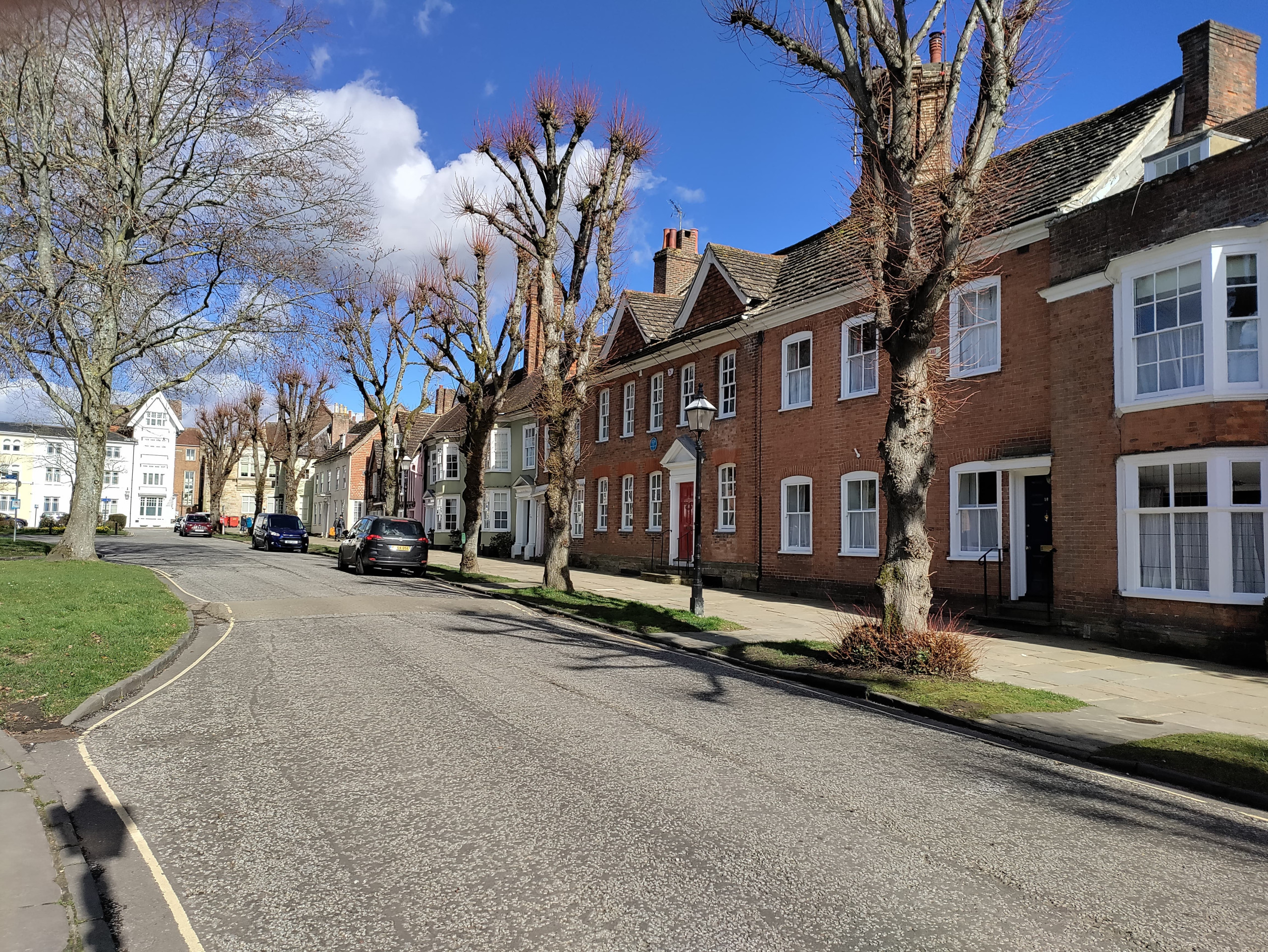 A tree-lined street of old houses in Horsham