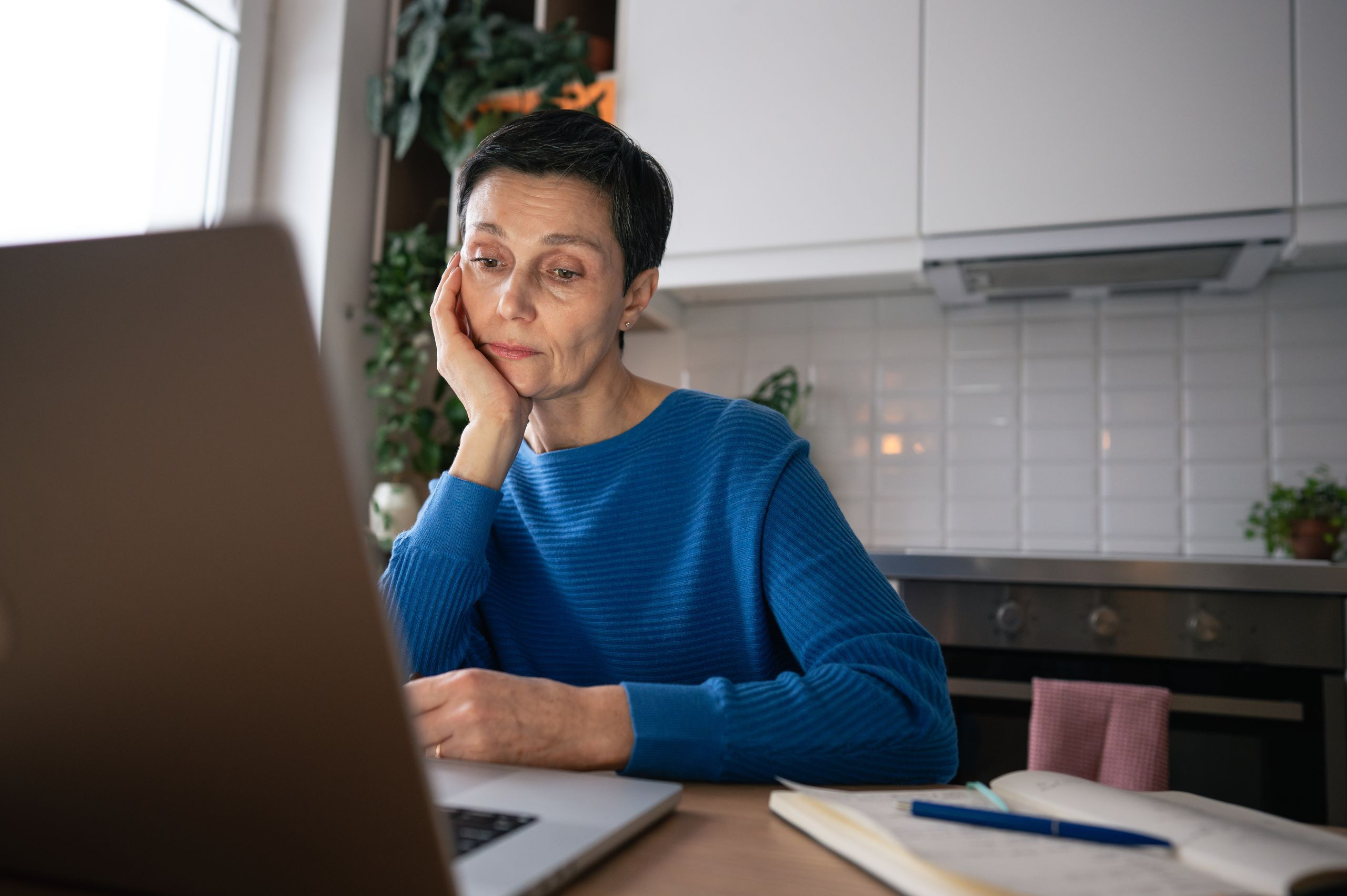 Tired woman working from home struggling to concentrate
