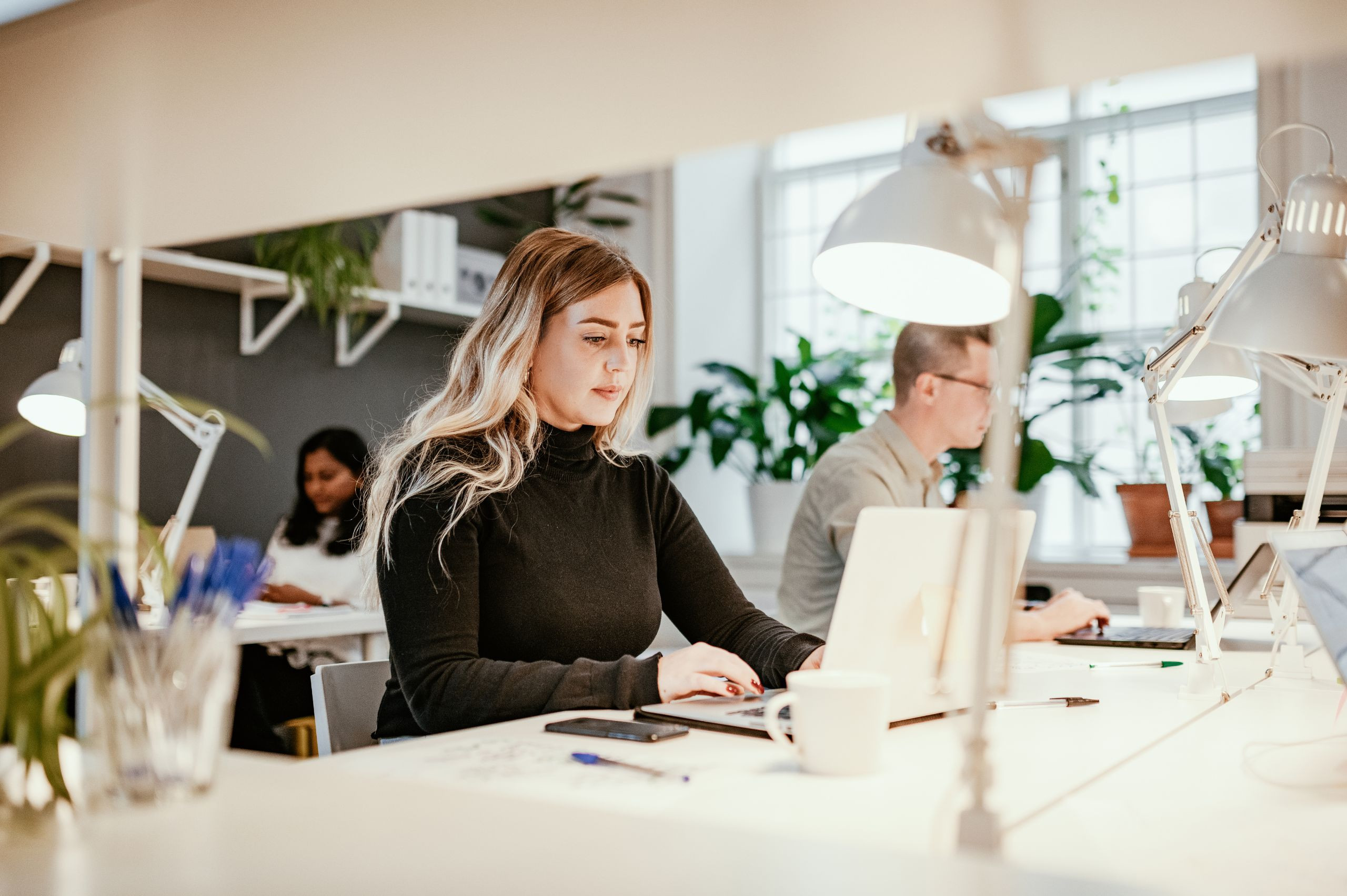 woman working on laptop at a desk