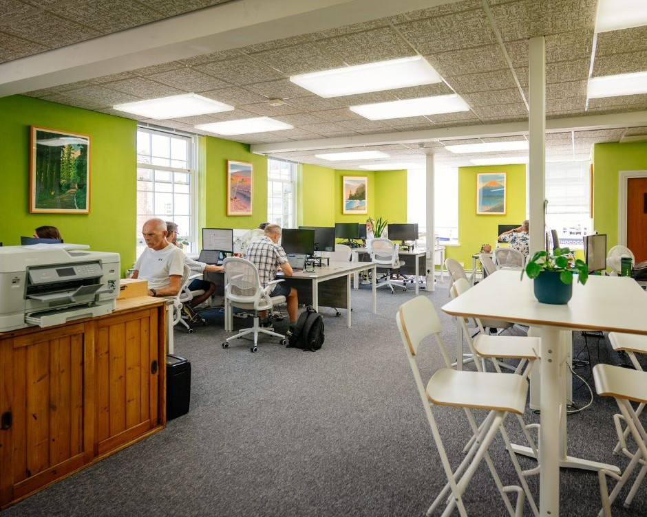 Horsham coworking office interior with printer, desks and communal area