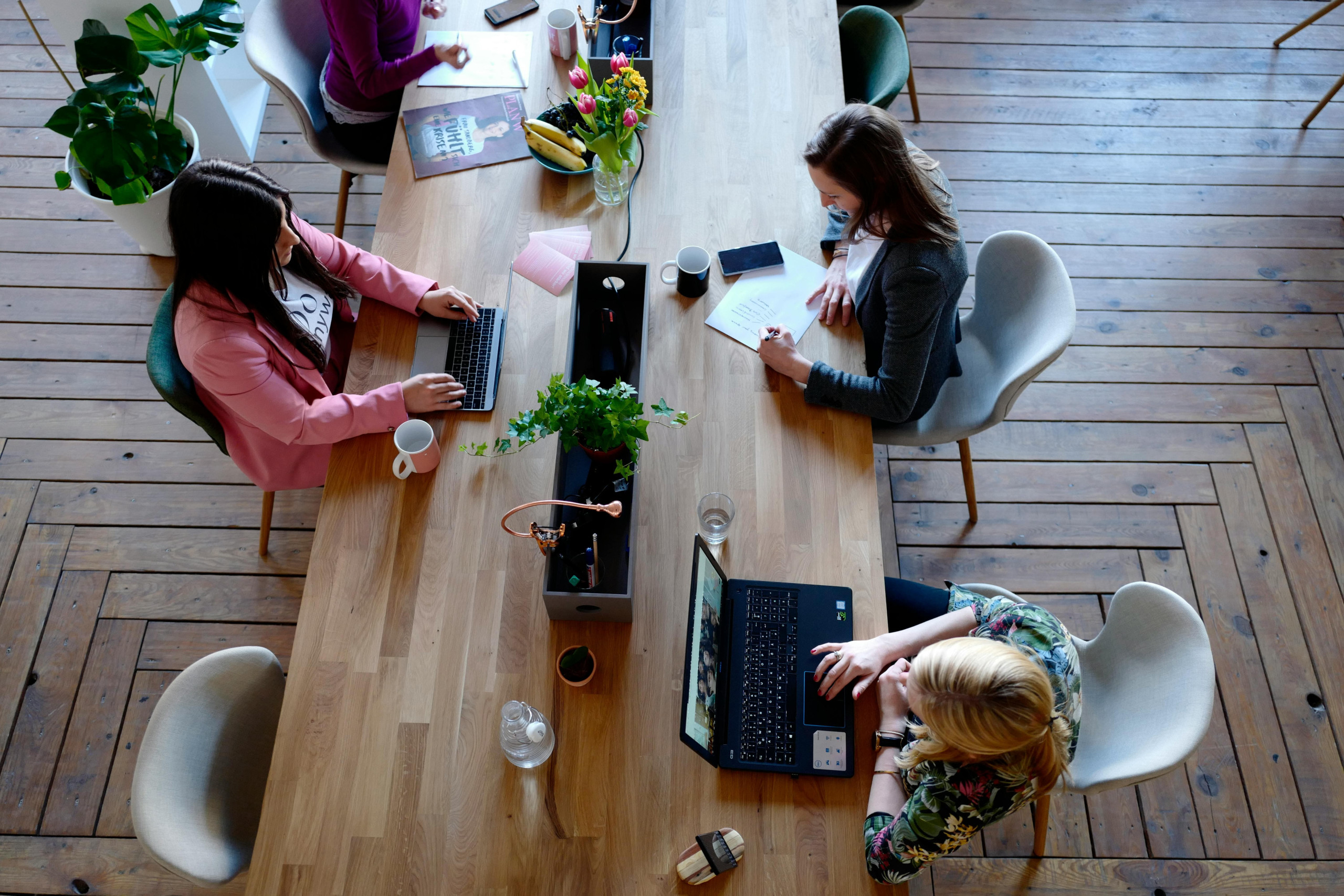 Three woman in a coworking space