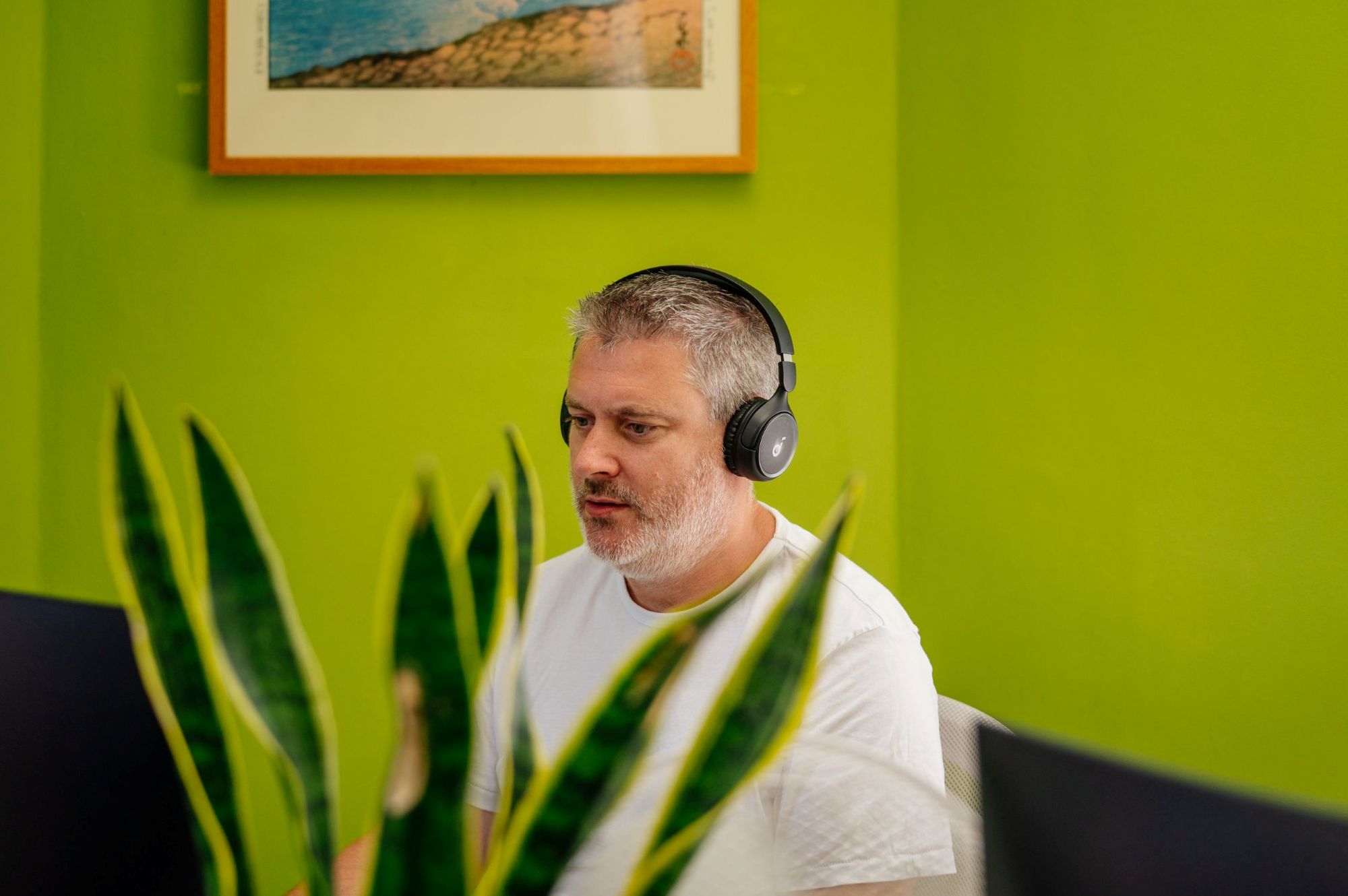 man working with headphones at horsham coworking