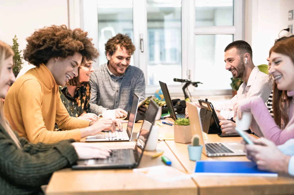 a group of men and women collaborating in a coworking space