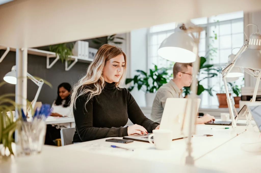 woman working on laptop at a desk