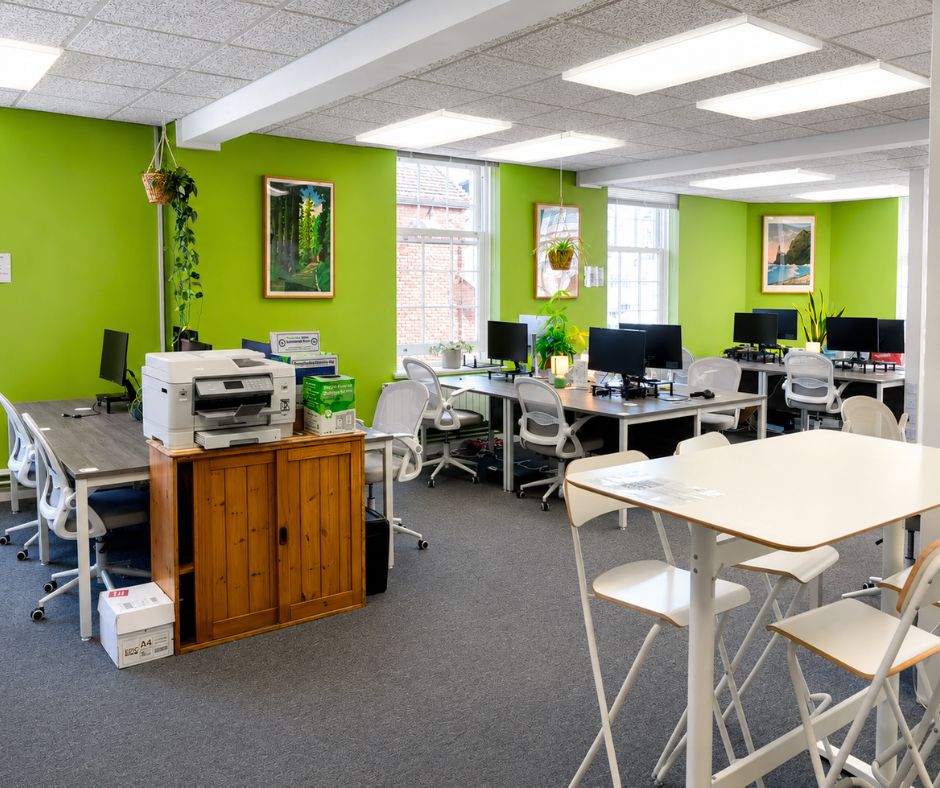 horsham coworking office interior with hanging planters and desk lights